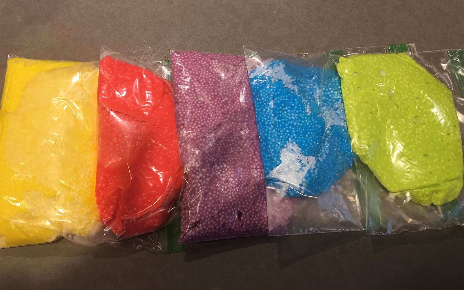 bags of different colored homemade floam